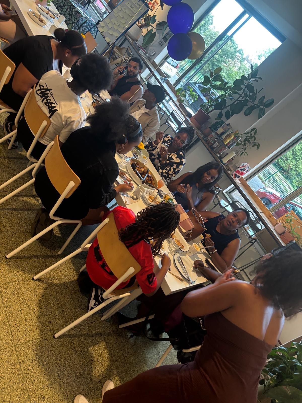 Community members gathered around the table at the EKing Foundation event