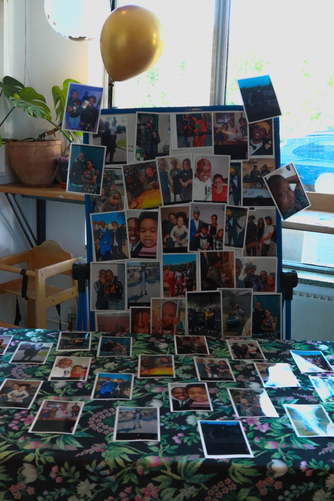 A board covered in printed photos of Eddie — memories shared at the EKing Foundation event