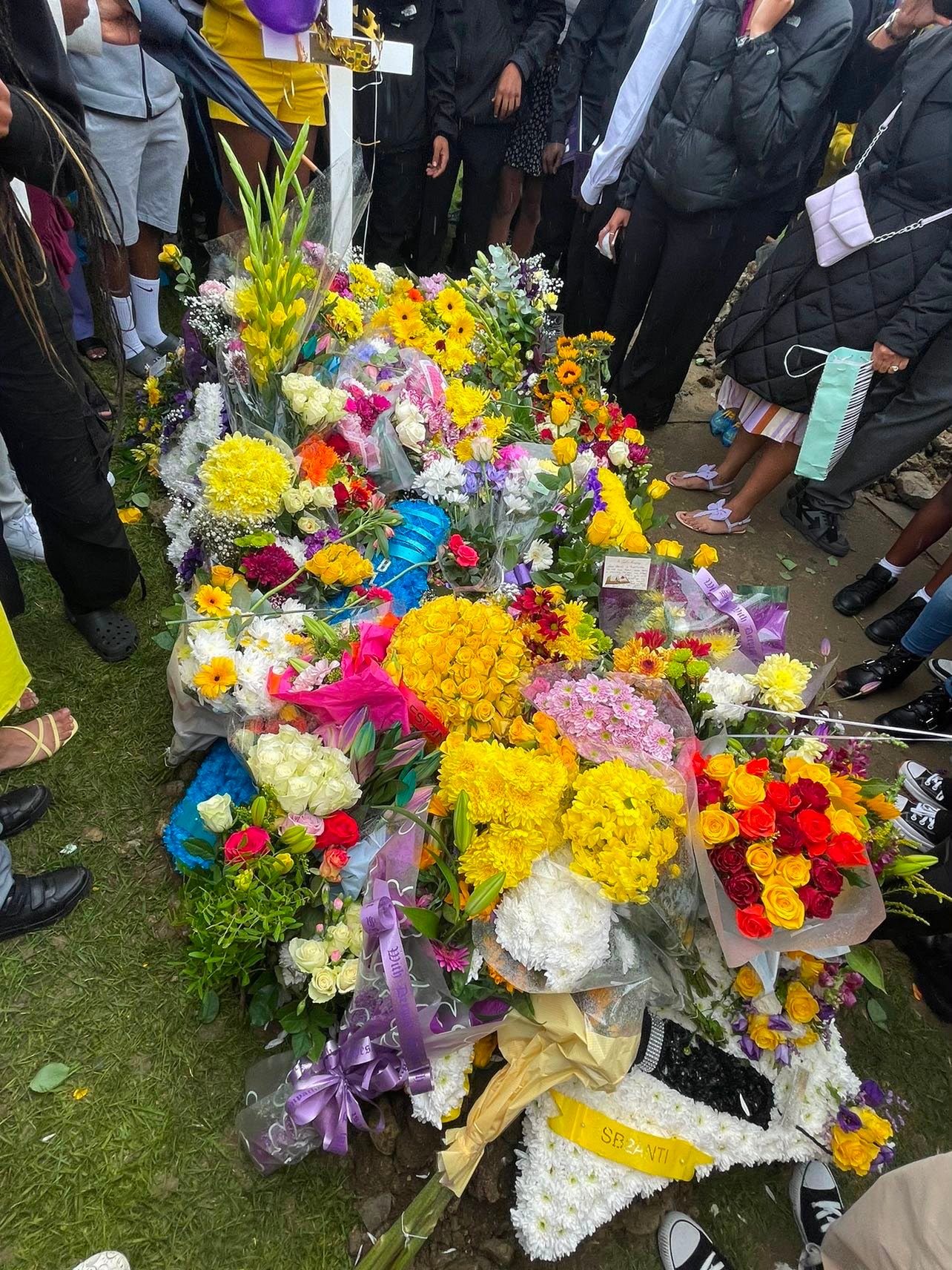 A sea of colourful flowers laid in tribute at Eddie's graveside